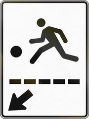 Regulatory road sign in Quebec, Canada - Playing children to the left