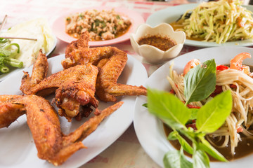 Thai style deep fried chicken with thai papaya salad