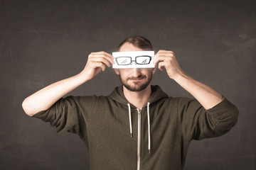 Happy guy looking with paper hand drawn eye glasses