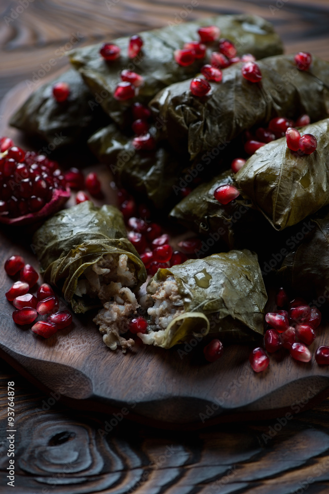 Wall mural Grape leaves stuffed with rice and meat, selective focus