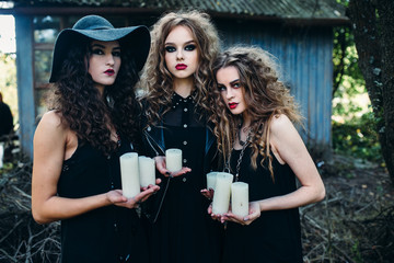three vintage women as witches