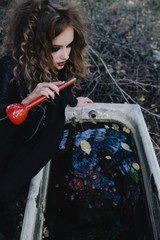 Vintage witch with elixir in hand