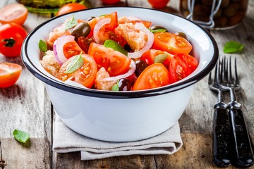 panzanella: Italian salad with tomatoes, ciabatta, olives, red onion and basil