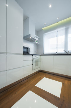 Interior of a modern luxury bright white kitchen