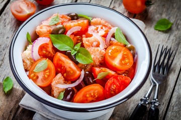 panzanella: Italian salad with tomatoes, ciabatta, olives, red onion and basil