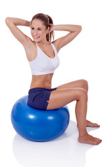 Fototapeta na wymiar Woman exercising on a fitness ball