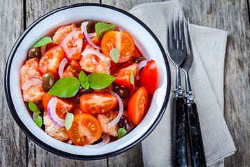 panzanella: Italian salad with tomatoes, ciabatta, olives, red onion and basil