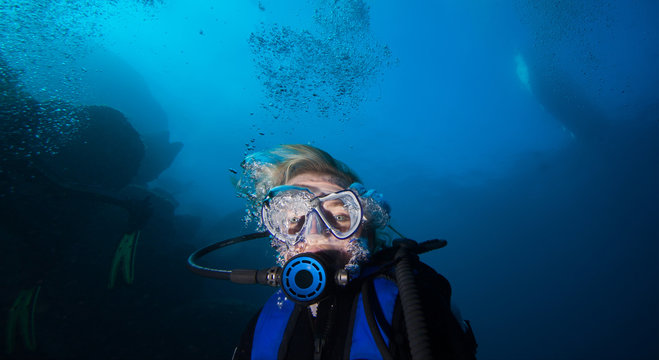 Woman scuba diver, mediterranean sea.