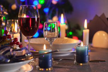 Fototapeta na wymiar Glass of wine on the christmas table