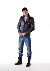 Fototapeta premium Handsome young man wearing leather jacket, t-shirt and jeans
