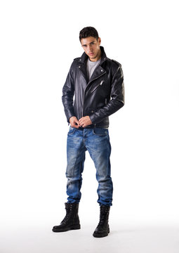 Handsome young man wearing leather jacket, t-shirt and jeans