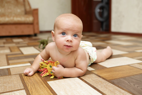  Baby playing with toy on the floor