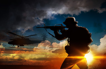 Silhouette of soldier at sunset