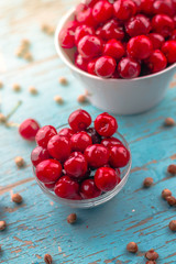 Sweet Cherry in Bowl on Rustic Table