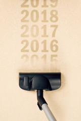 Vacuum Cleaner Sweeping Year Number 2015 from Carpet