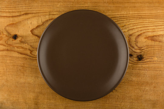 brown plate on wooden table