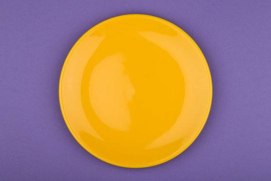 yellow plate on purple background