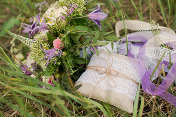 Golden wedding rings on decorated little pillow