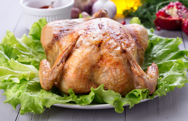 Homemade roasted chicken for festive dinner. 