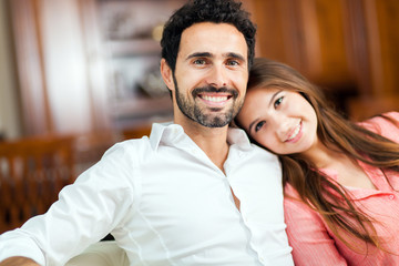 Young couple on the sofa in love