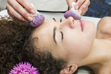 Thai facial massage with grape bags