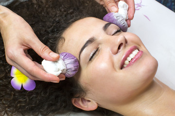 Thai facial massage with grape bags