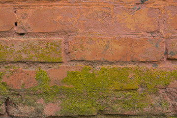 Old red painted brick wall