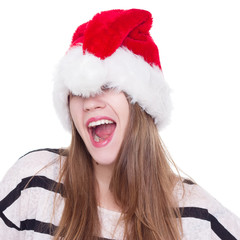 Expressive emotional girl in a Christmas hat on white background