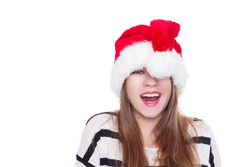 Expressive emotional girl in a Christmas hat on white background