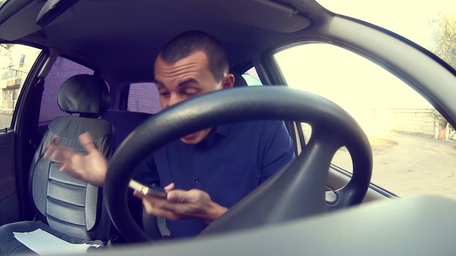 businessman man manager in car talking on the telephone bug