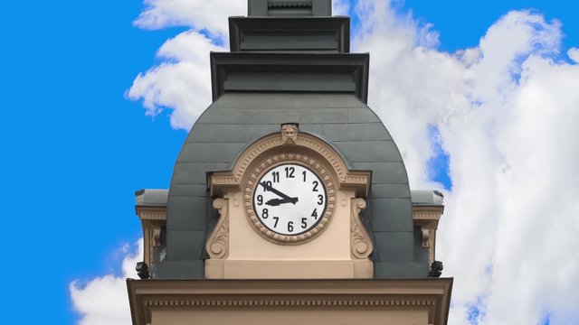 Passing of time, time lapse animation of historical clock tower with fast moving clouds.