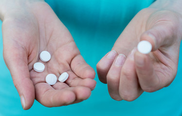 Close-up of two human hands, the hands are pills

