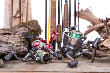 fishing reels and rods with boards and snag