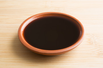 Small bowl of liquid mesquite flavoring