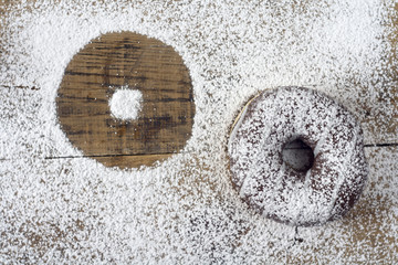 donut lying on a wooden table