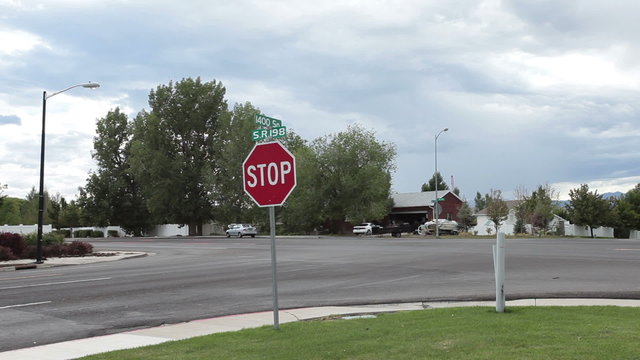 Road intersection busy traffic at stop sign fast timelapse HD 1551