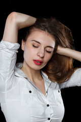 Young casual woman isolated over black background