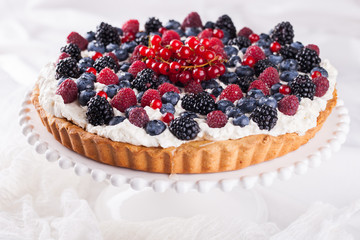Tart with berries and whipped cream.