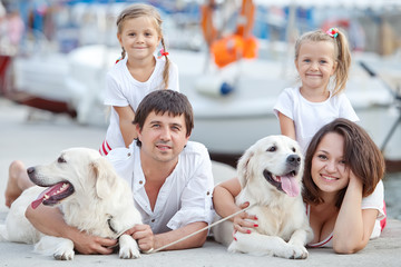 Happy family with dog friend
