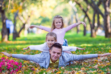 Fototapeta premium Happy family in autumn park outdoors