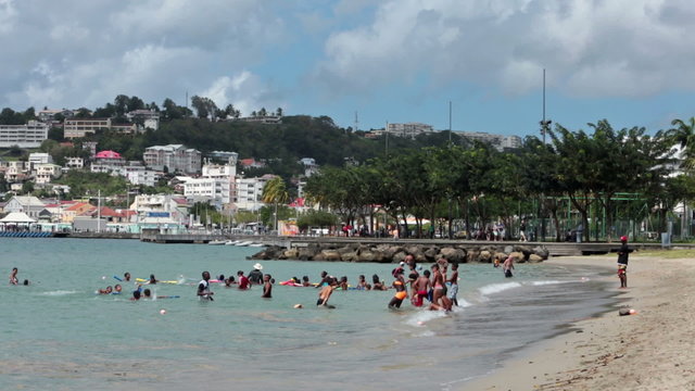Martinique school children swimming at beach fast HD 1479