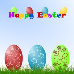 Colorized Easter eggs on the grass