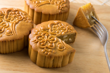 Chinese traditional mooncake , on wooden cutting boards