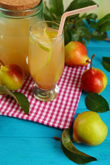 Fresh pear juice with fruit on table close up