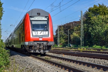 Obraz premium Passenger train hauled by electric locomotive