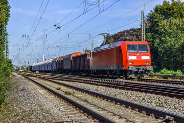 Fototapeta na wymiar Passenger train hauled by electric locomotive