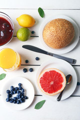Healthy breakfast with fruits and berries on table close up