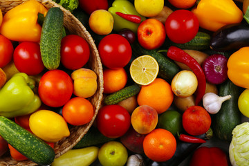 Fototapeta na wymiar Heap of fresh fruits and vegetables close up