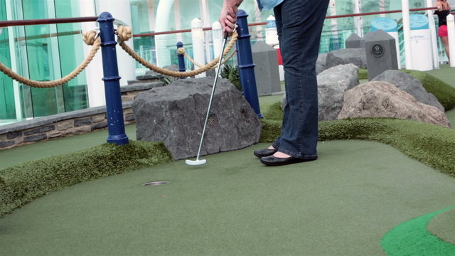 Woman plays Miniature golf cruise ship HD 1802