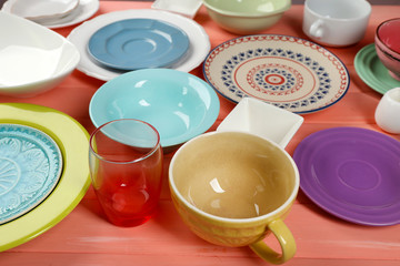 Different tableware on wooden table close up